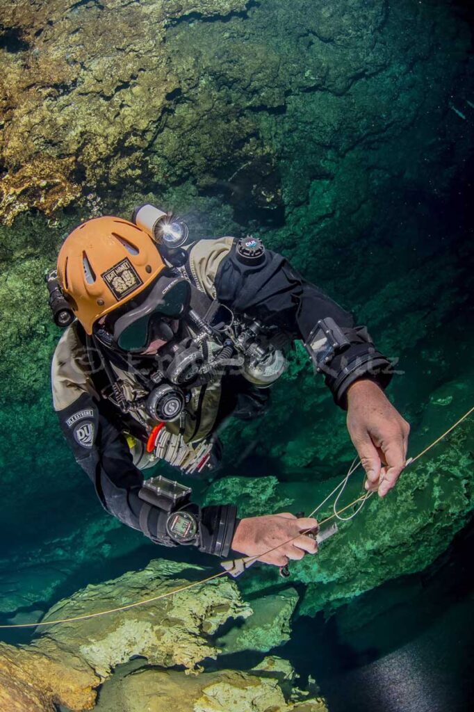 Sidemount Diver Exploring Caves